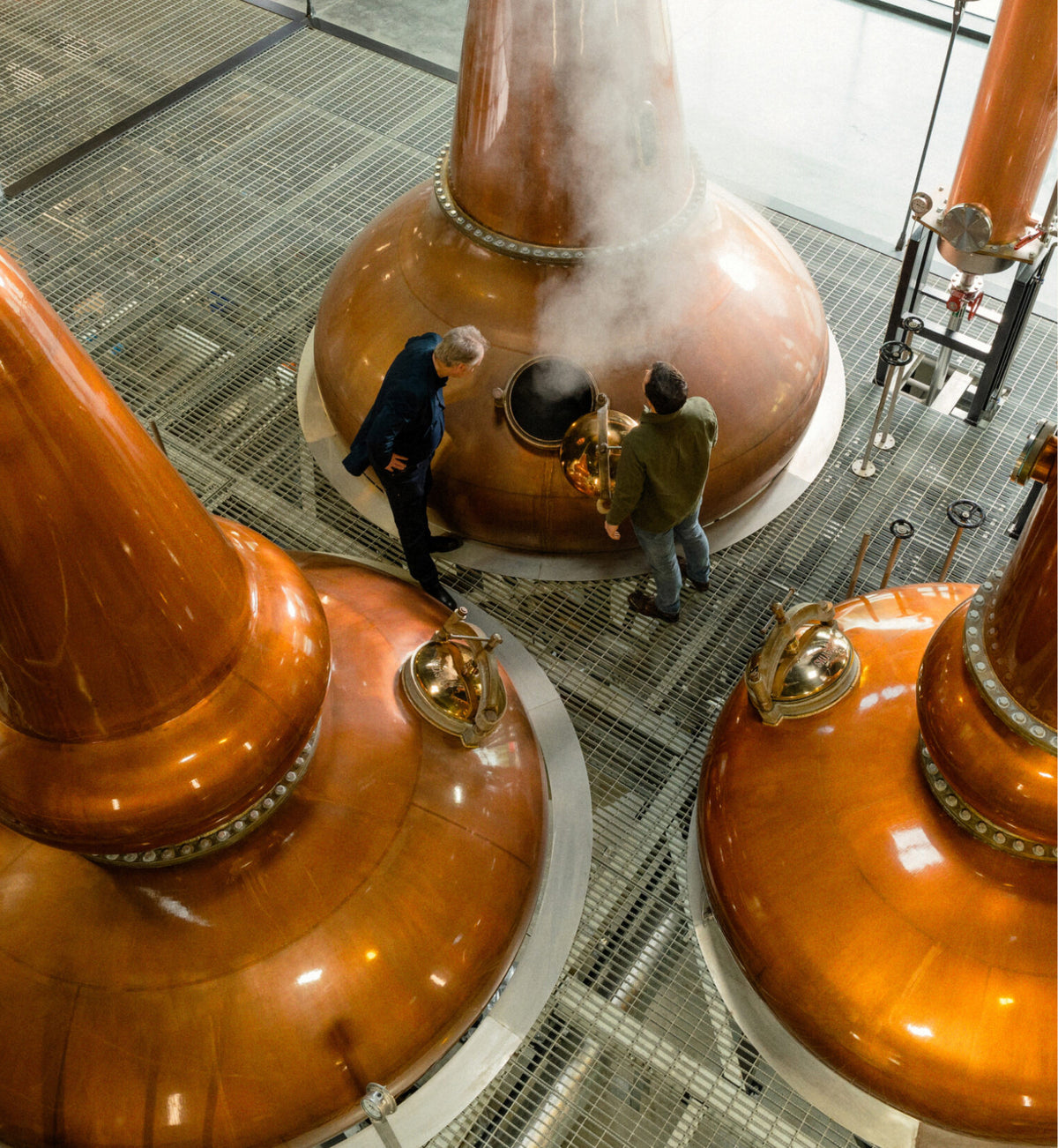Copper pot stills inside the Church of Oak distillery